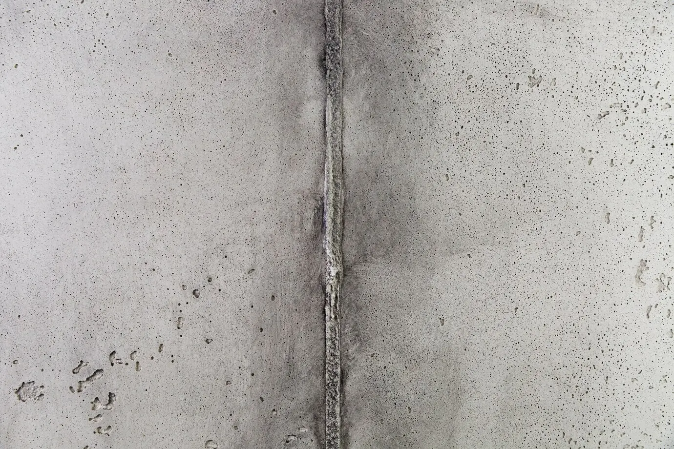 Corner of a concrete wall with a rough surface