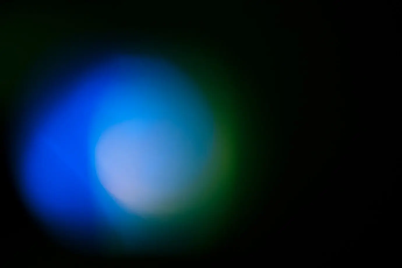 A bright light against a black background.